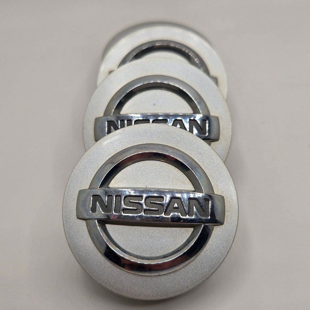Nissan Wheel Center Caps Set of 4 Silver Chrome Logo OEM